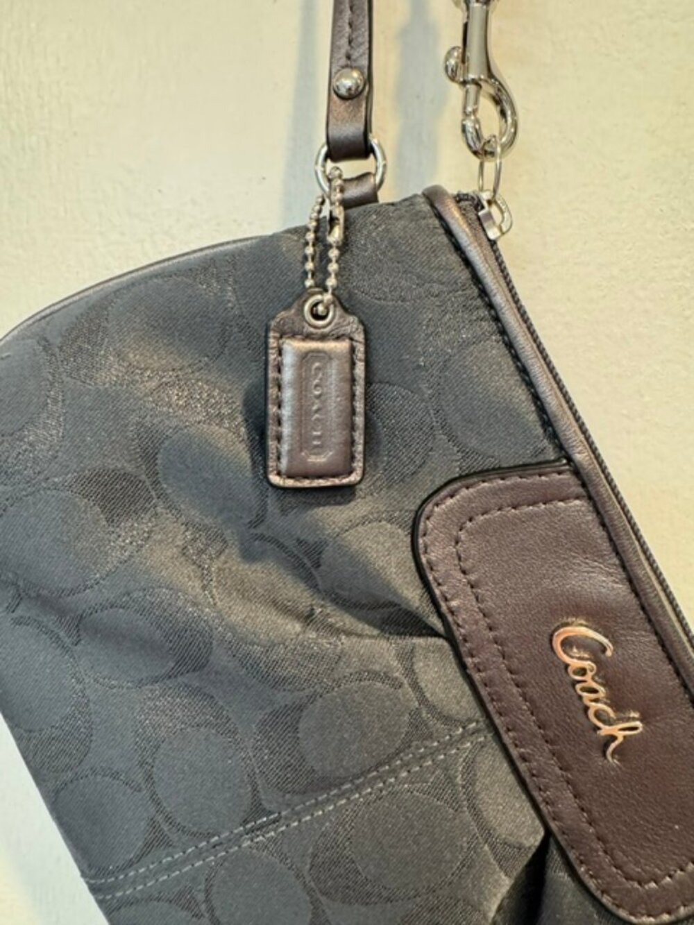 Classic Coach charcoal black wristlet. Nylon with metallic and leather accents.